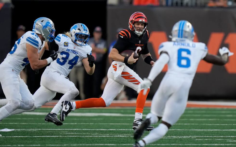 Cincinnati Bengals quarterback Jake Browning (6) runs the ball agains the Detroit Lions at...