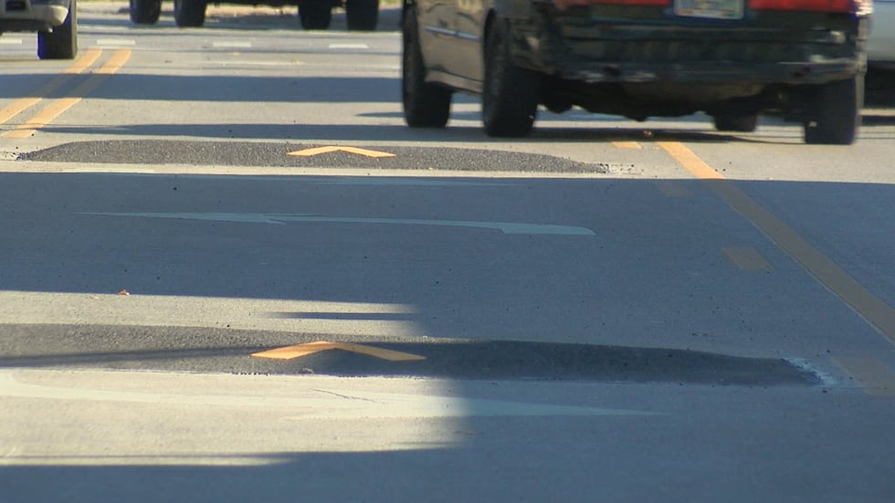 Bumpy Curb City installs lane bumps on Glenway Avenue to curb unsafe driving