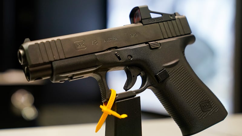 A Glock 48 9mm pistol is shown as guests browse firearms at the National Rifle Association's...