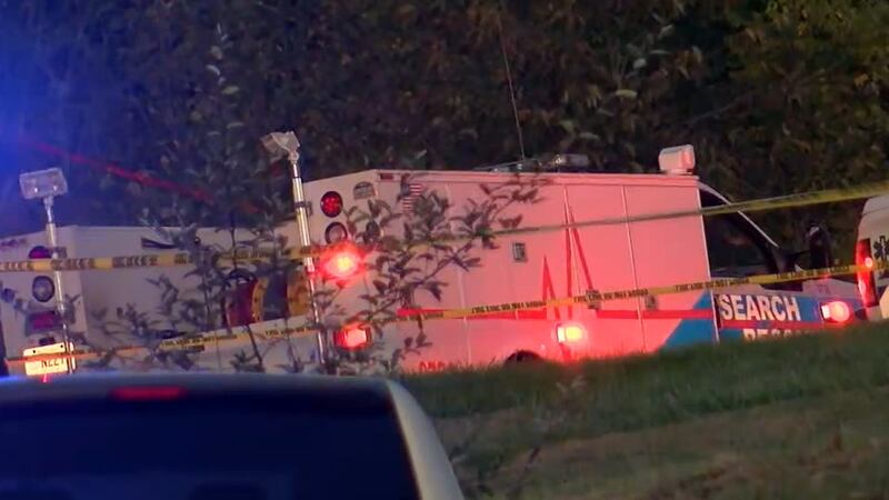 First responders on scene of a fatal medical helicopter crash in Owen County, Ky., on Monday,...