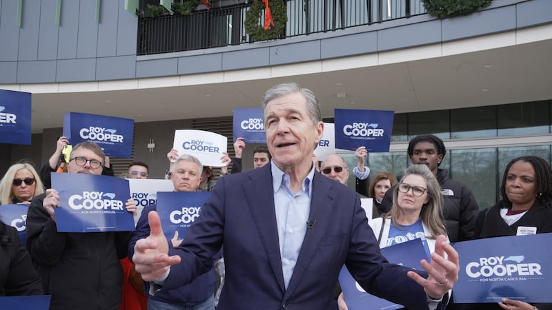 Democratic former Gov. Roy Cooper, who is running for U.S. Senate, speaks to reporters after...