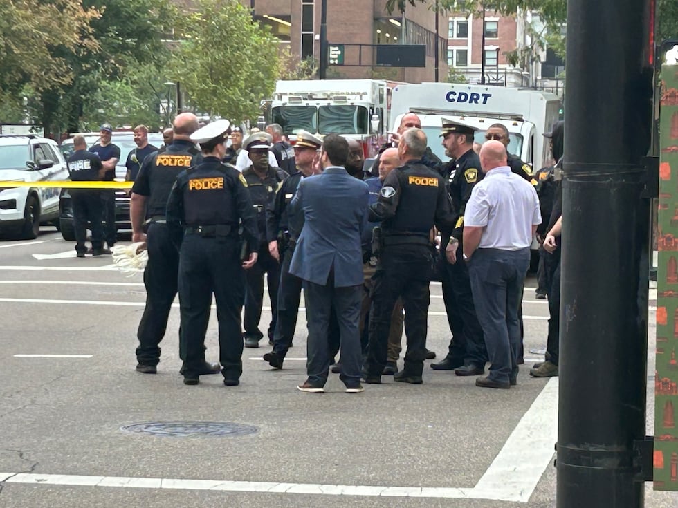 9 arrested after activists chain themselves to Kroger headquarters
