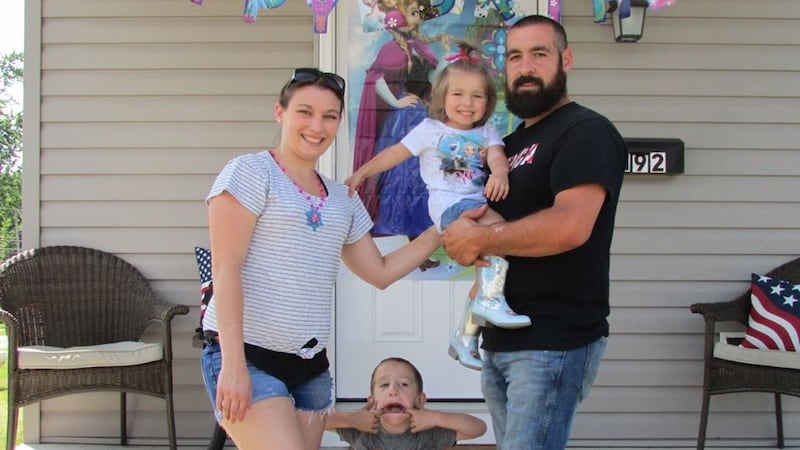 Autumn Boothe, who was diagnosed with leukemia before she was one, is being held by her father...