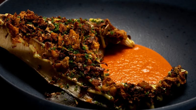 Hamachi collar with romesco sauce, potato crumble and garlic aioli.