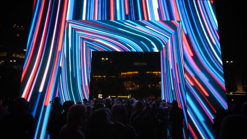 Fifth Third's BLINK installation at Fountain Square features over a dozen doors, light frames...