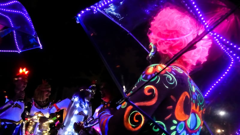 Revelers gather in Washington Park during the Blink Festival, Thursday, Oct. 12, 2017, in...
