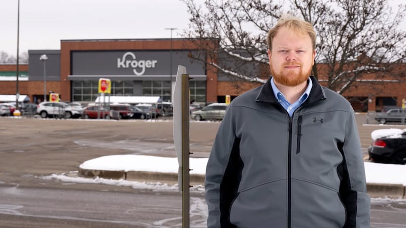 Thomas Schell, a former Kroger worker and assistant store manager, stands outside a store...