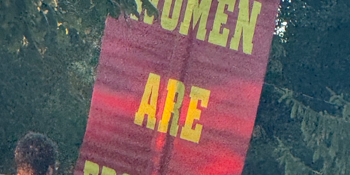 Parents counter-protest man’s offensive signs targeting women outside Oak Hills High School